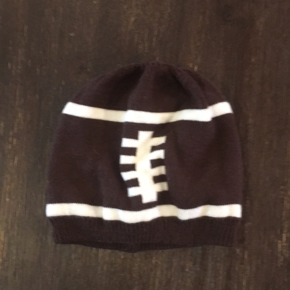 Children place football hat baby